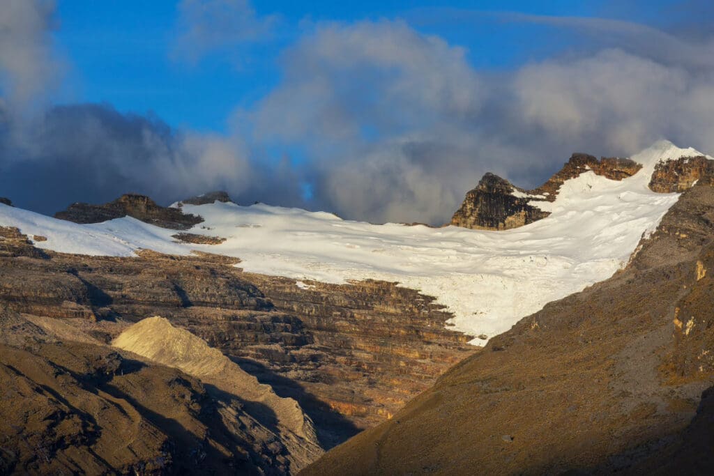 Hidden Places Around the World,Snow-capped peaks of El Cocuy Mountain Range in Colombia under a cloudy sky.