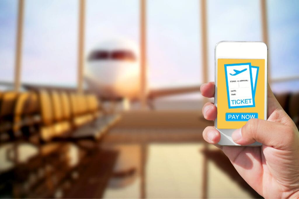 Travel on a Whim, A smartphone showing a flight ticket booking interface with an airplane in the background.
